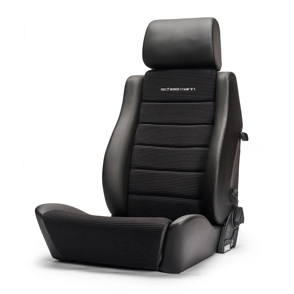 scheel-mann Traveler R in black with corduroy center seat bottom and backrest.