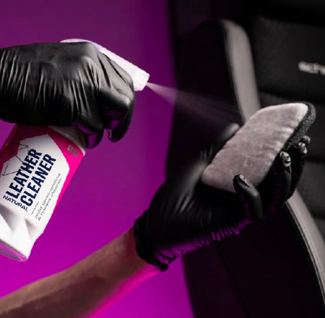 GYEON Q²M LeatherCleaner Natural sprayed onto a brush before cleaning a seat