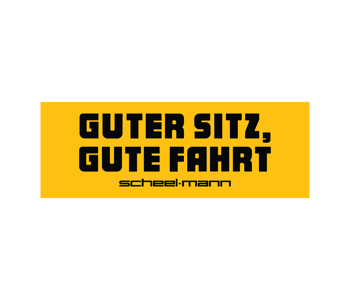 Large yellow sticker with 'Guter Sitz, Gute Fahrt!' printed in black, and the scheel-mann name in black text below.
