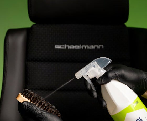 GYEON Q²M FabricCleaner Natural sprayed onto a brush before cleaning a seat