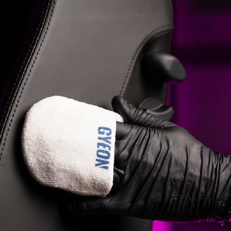 GYEON microfiber applicator used on a black leather scheel-mann seat